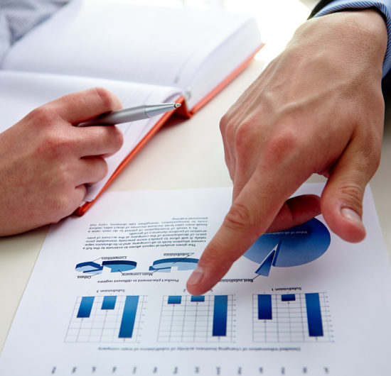 Male hand pointing at business document while explaining it